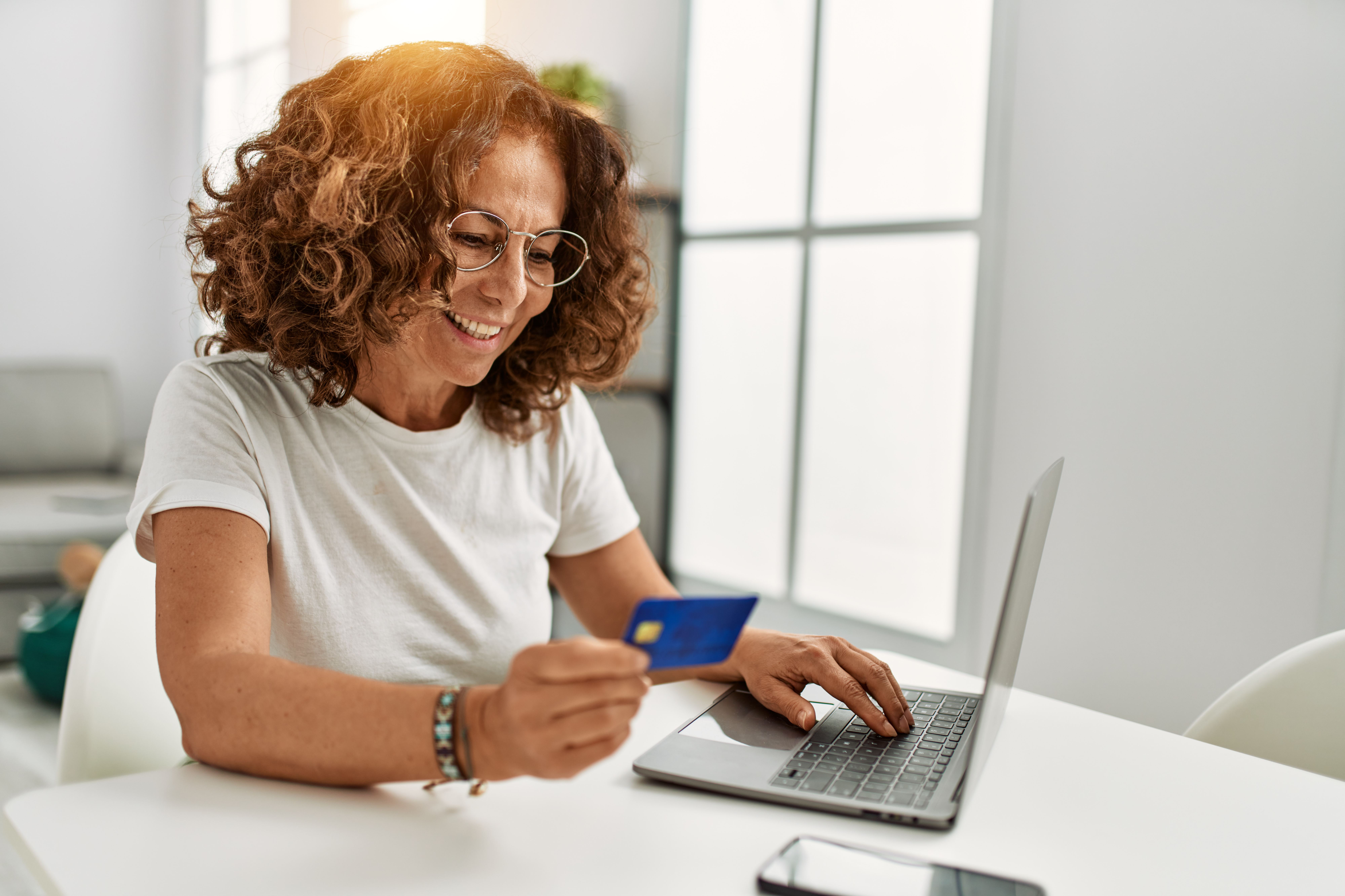 Woman making online payment with credit card